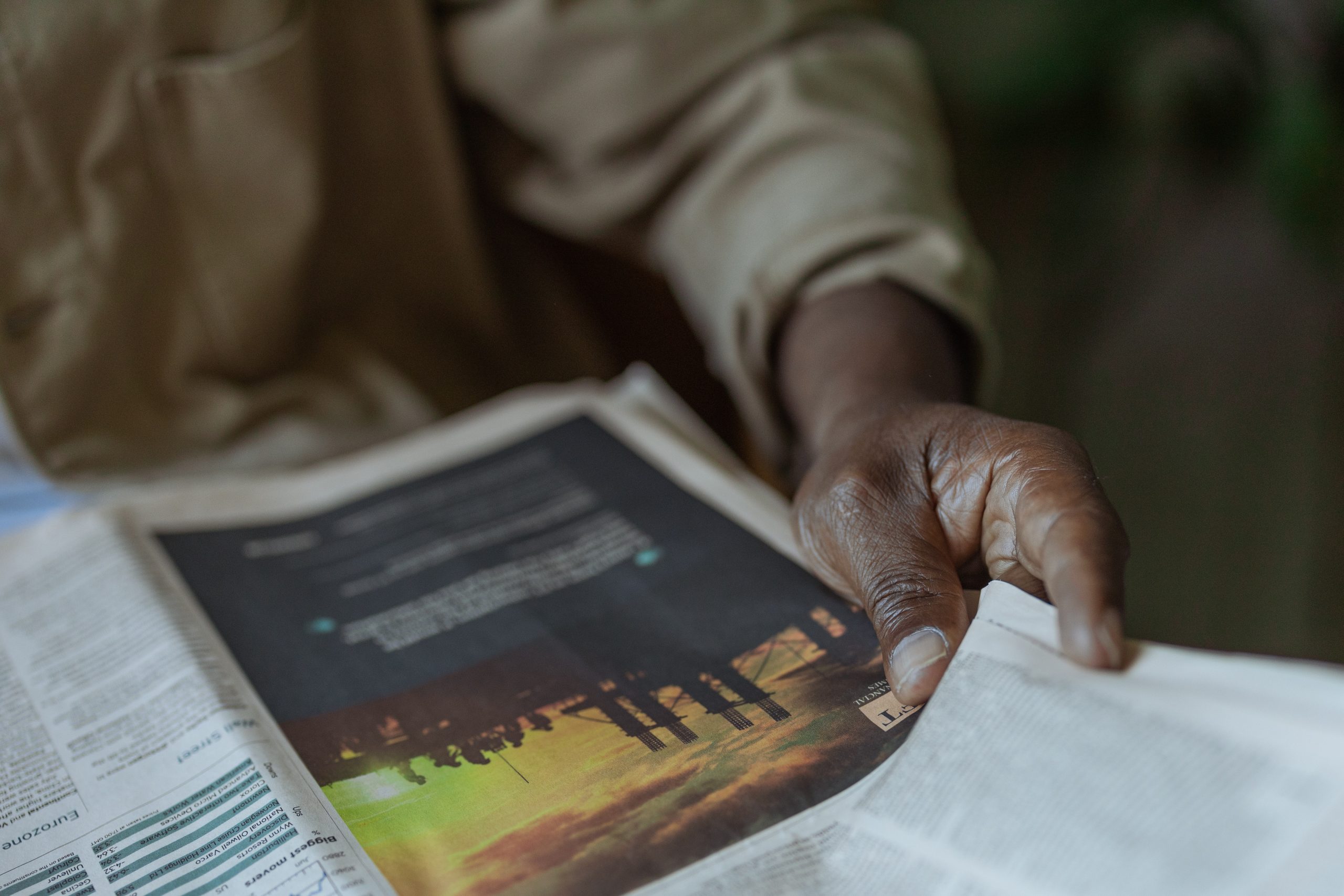 Person reading a newspaper - Photo by Ron Lach @Pexels