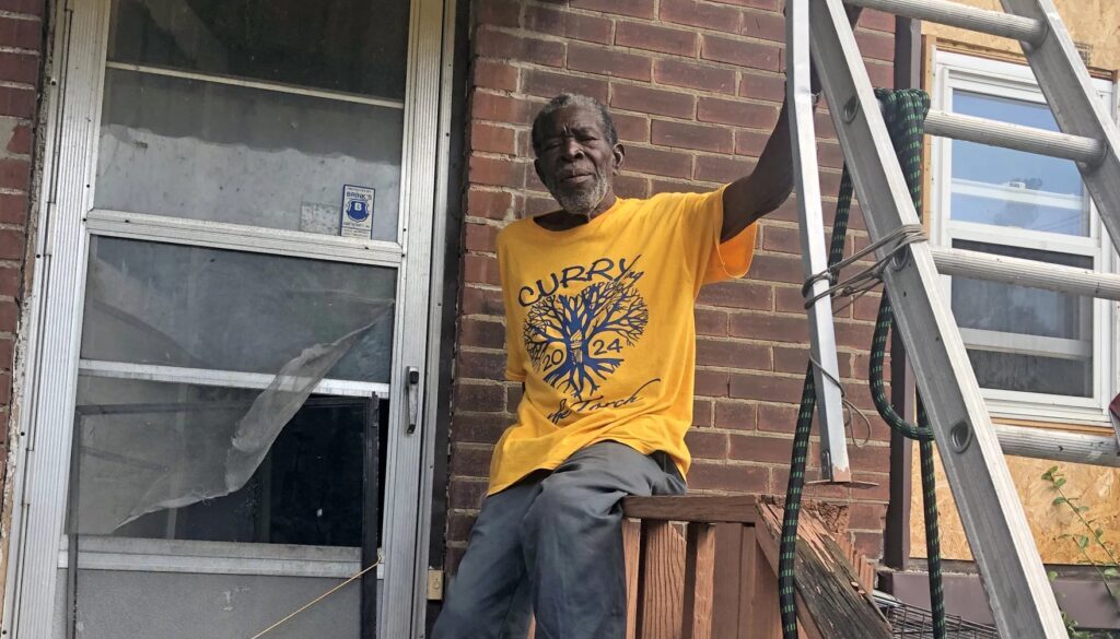 Ernest Curry at damaged home