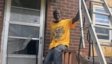 Ernest Curry at damaged home